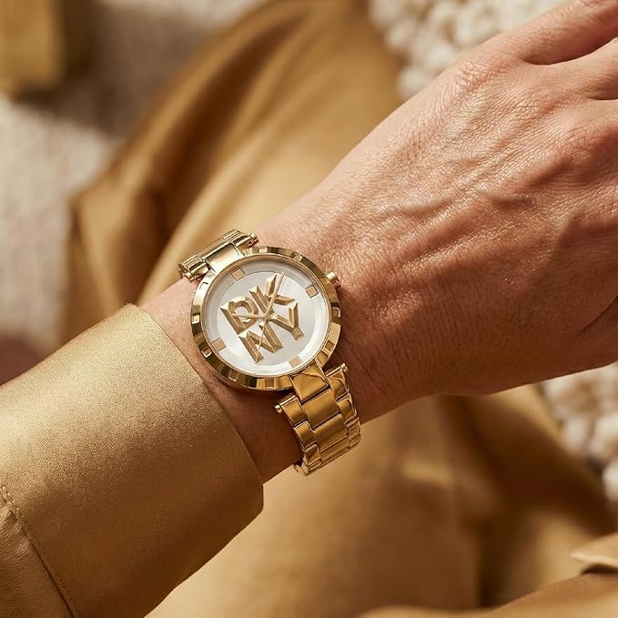 DKNY Essential Logo Analog Plain 3-Hands Japanese Movement Silver White Round Dial with Gold Bracelet 18 x 16 mm, 50 m Water Resistance Women's Wrist Watch